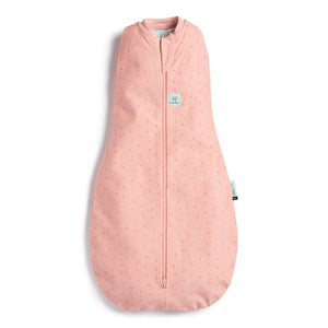Front of the pink coloured cocoon style sleeping bag with small berry theme prints on it
