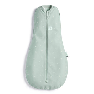 Front of the pale green coloured cocoon style sleeping bag with small sage leaf prints on it